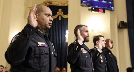 U.S. Capitol Police Sgt. Aquilino Gonell (from left), officers Michael Fanone and Daniel Hodges of the Washington, D.C., Metropolitan Police Department, and Capitol Police Pfc. Harry Dunn are sworn in Tuesday before testifying before the House select committee investigating the Jan. 6 attack.
