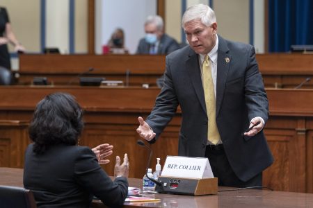 Texas State Democratic Rep. Nicole Collier, left, who is also the chair of the Texas Legislative Black Caucus, speaks with Rep. Pete Sessions, R-Texas, at the start of a House Committee on Oversight and Reform hearing about voting rights in Texas, Thursday, July 29, 2021, on Capitol Hill in Washington.