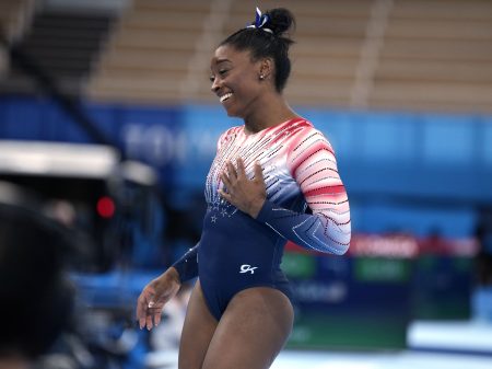 U.S. star Simone Biles looks relieved as she finishes the balance beam during the artistic gymnastics women's apparatus final on Tuesday at the Summer Olympics in Tokyo.
