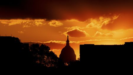 The U.S. Capitol Dome is silhouetted against the rising sun, Friday, April 30, 2021 in Washington.