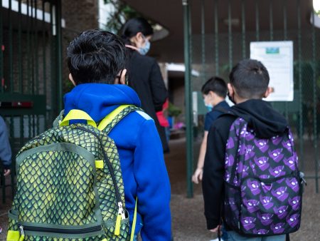 Children head into Benbrook Elementary for the first day of school on Aug. 23, 2021. HISD is requiring masks for all students and staff, and limited virtual learning, but some parents are still worried.