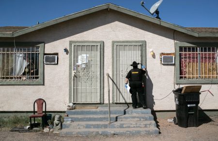 Maricopa County constable Darlene Martinez knocks on a door before posting an eviction order on Oct. 1, 2020, in Phoenix. An extended eviction moratorium ordered by the Centers for Disease Control and Prevention has been struck down.