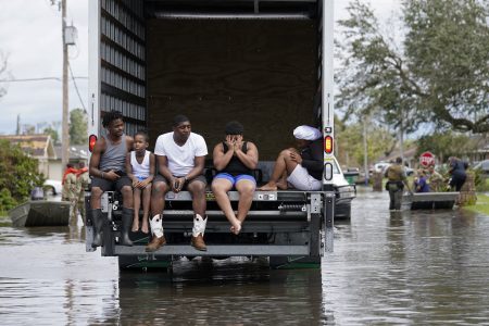 People are evacuated from floodwaters in the aftermath of Hurricane Ida in LaPlace, La., Monday, Aug. 30, 2021.