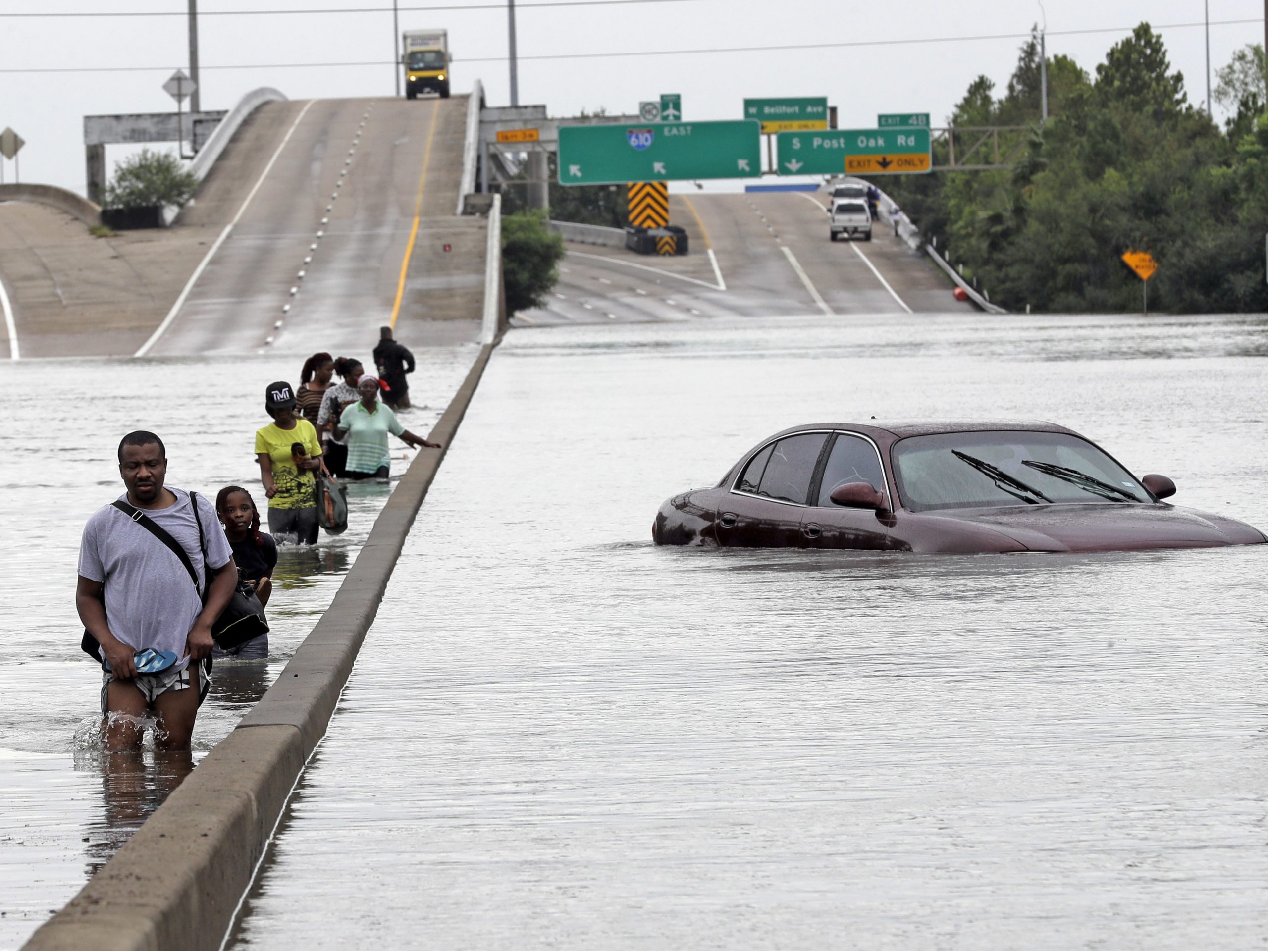 A flooded section of Interstate 610 in Houston after Tropical Storm Harvey in August 2017. The city now uses railroad crossing gates and water-activated sensors to help keep cars out of flooded underpasses.