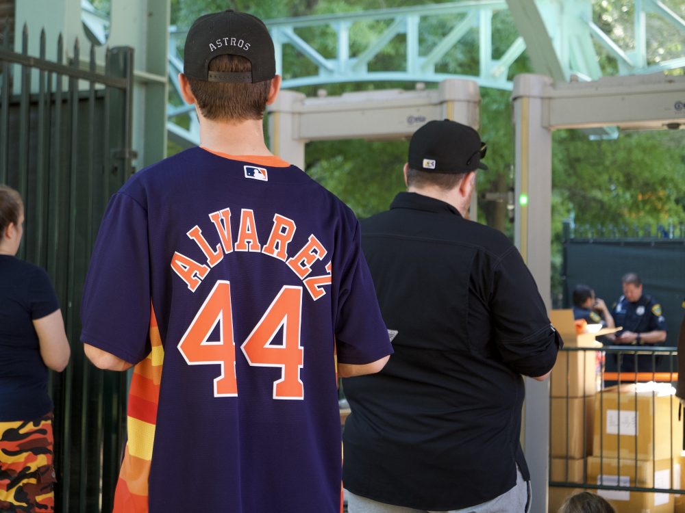 A fan wears a Yordan Alvarez jersey outside of Minute Maid Park in downtown Houston on Oct. 7, 2021. Alvarez homered and doubled, driving in two runs in the Astros' AL Division Series Game 1 victory over the Chicago White Sox.