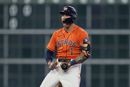 Houston Astros shortstop Carlos Correa (1) celebrates after hitting a two-run double against the Chicago White Sox during the seventh inning in Game 2 of a baseball American League Division Series Friday, Oct. 8, 2021, in Houston.