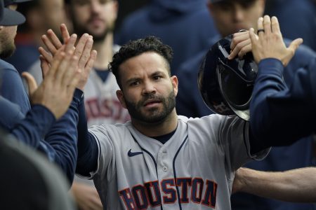 Houston Astros' Jose Altuve celebrates scoring against the Chicago White Sox in the eighth inning during Game 4 of a baseball American League Division Series Tuesday, Oct. 12, 2021, in Chicago.