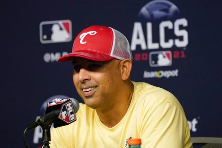 Boston Red Sox manager Alex Cora smiles as he responds to questions during a news conference before baseball practice in Houston, Thursday, Oct. 14, 2021. The Red Sox play the Houston Astros in Game 1 of the American League Championship Series on Friday.