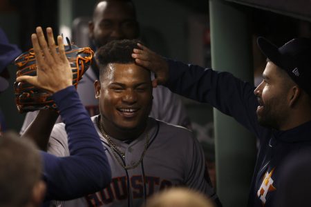 Houston Astros starting pitcher Framber Valdez celebrates in the dugout after the eighth inning in Game 5 of baseball's American League Championship Series against the Boston Red Sox Wednesday, Oct. 20, 2021, in Boston.