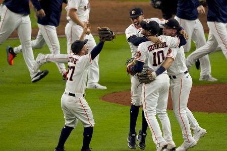 The Houston Astros celebrate their win against the Boston Red Sox in Game 6 of baseball's American League Championship Series Friday, Oct. 22, 2021, in Houston. The Astros won 5-0, to win the ALCS series in game six.