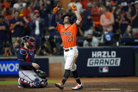 Houston Astros' Jose Altuve celebrates after a home run during the seventh inning in Game 2 of baseball's World Series between the Houston Astros and the Atlanta Braves Wednesday, Oct. 27, 2021, in Houston.