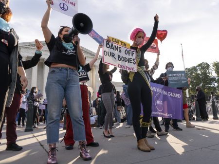 Pro-abortion rights and anti-abortion activists rally outside the Supreme Court on Monday, as the justices heard arguments about Texas's controversial abortion law.