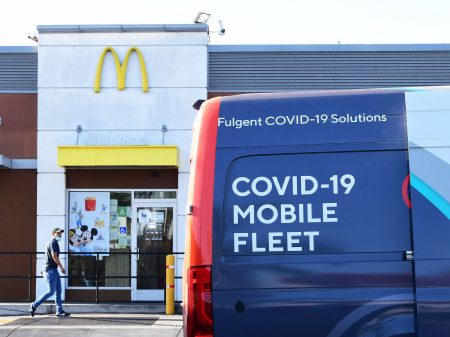 A man approaches a van from a COVID-19 vaccine mobile clinic hosted by McDonald's and the California Department of the Public Health on September 21, 2021 in Los Angeles, California.