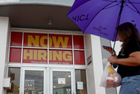 MIAMI BEACH- NOVEMBER 05: A ''Now Hiring" sign hangs above the entrance to a McDonald's restaurant on November 05, 2021 in Miami Beach, Florida. The Labor Department reported today that the U.S. job market in October showed that non-farm payrolls rose more than expected and that the unemployment rate fell to 4.6%.