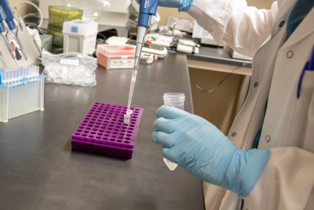 A Houston Methodist COVID-19 genome sequencer tests a strain of the virus on Dec. 7, 2021.