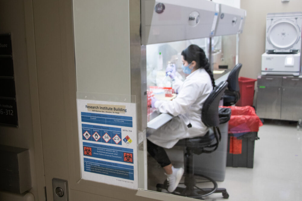 A Houston Methodist COVID-19 researcher tests a strain of the virus on Dec. 7, 2021.