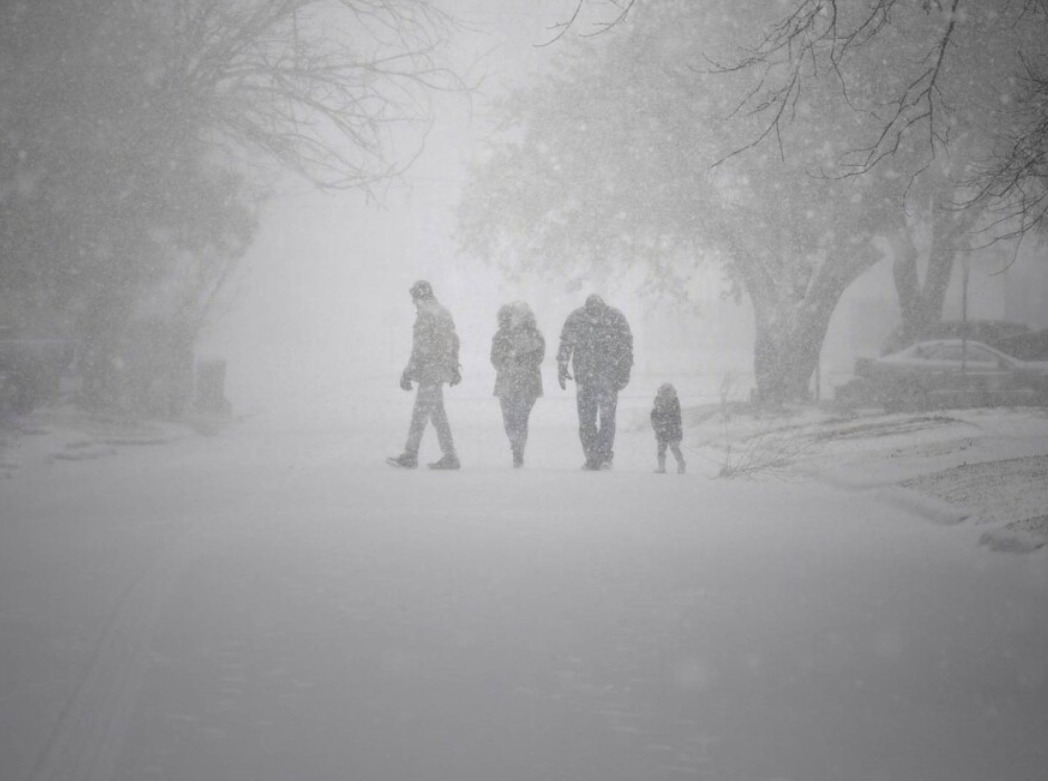 Winter storm knocks out power for thousands and threatens roadways ...
