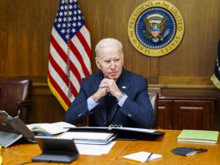 This image provided by The White House via Twitter shows President Joe Biden at Camp David, Md., Saturday, Feb. 12, 2022. Biden on Saturday again called on President Vladimir Putin to pull back more than 100,000 Russian troops massed near Ukraine’s borders and warned that the U.S. and its allies would “respond decisively and impose swift and severe costs” if Russia invades, according to the White House.