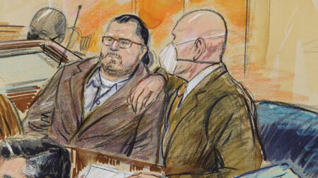 This artist sketch depicts Guy Wesley Reffitt, left, and his lawyer William Welch, right, in Federal Court in Washington, D.C., on Feb. 28.
