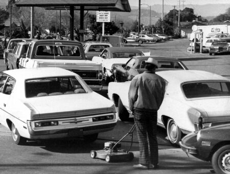 ** ADVANCE FOR TUESDAY, JAN. 22 ** ** FILE **  Drivers and a man pushing a lawnmower line up at gas station in San Jose, Calif. in this March 15, 1974 file photo.  The most severe recession in the postwar era was from November 1973 to March 1975, prompted by an Arab oil embargo. Inflation ran into double digits and stocks tumbled 25 percent during the recession and lost nearly half their value during the entire down cycle. (AP Photo)