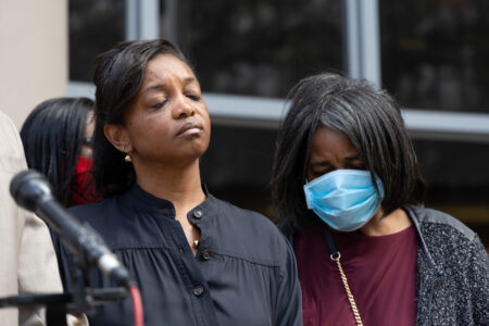 Shanetta Lewis stands among family members after announcing a federal lawsuit against the Houston police officers who killed her son, Charion Lockett. Taken on March, 17, 2022.