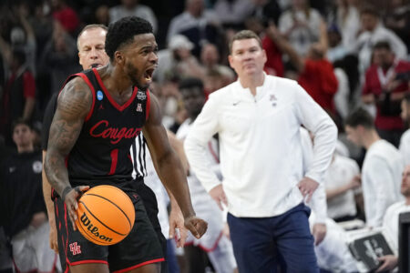 Houston guard Jamal Shead celebrates after scoring as Arizona head coach Tommy Lloyd looks on during the second half of a college basketball game in the Sweet 16 round of the NCAA tournament on Thursday, March 24, 2022, in San Antonio.