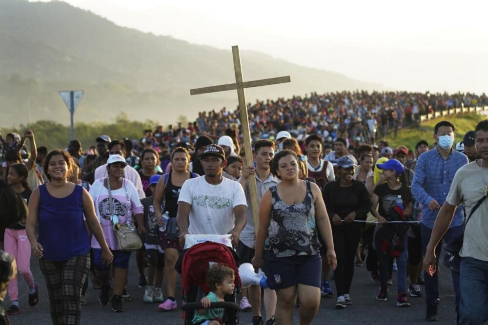 Migrants leave Huixtla, Chiapas state, Mexico, Oct. 27, 2021, as they continue their trek north toward Mexico's northern states and the U.S. border. The Biden administration is reportedly considering an end to Title 42, a health directive that's led to mass expulsion of asylum seekers at the border.