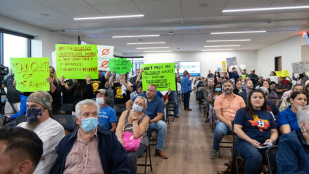 Community members attended a TCEQ meeting on April 7, 2022 in protest of a proposed concrete batch plant.