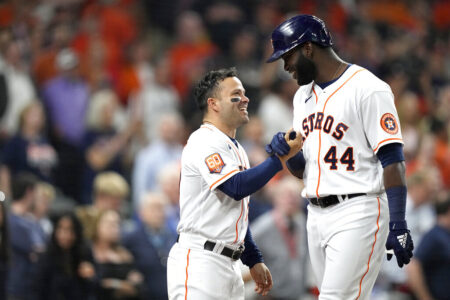 Houston Astros' Yordan Alvarez (44) celebrates with Jose Altuve after hitting a two-run home run against the Los Angeles Angels during the seventh inning of a baseball game Monday, April 18, 2022, in Houston.