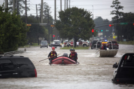 Two rescue boats from the Georgetown Sherrif's Dept. help evacuate residents from their homes as Hurricane Harvey brought record floods to the Houston Area in 2017.