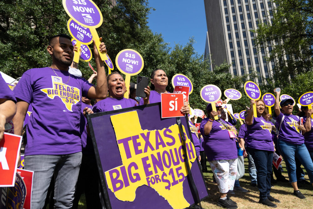 Houston janitors protest for a $15 minimum wage near City Hall on May 18, 2022. 