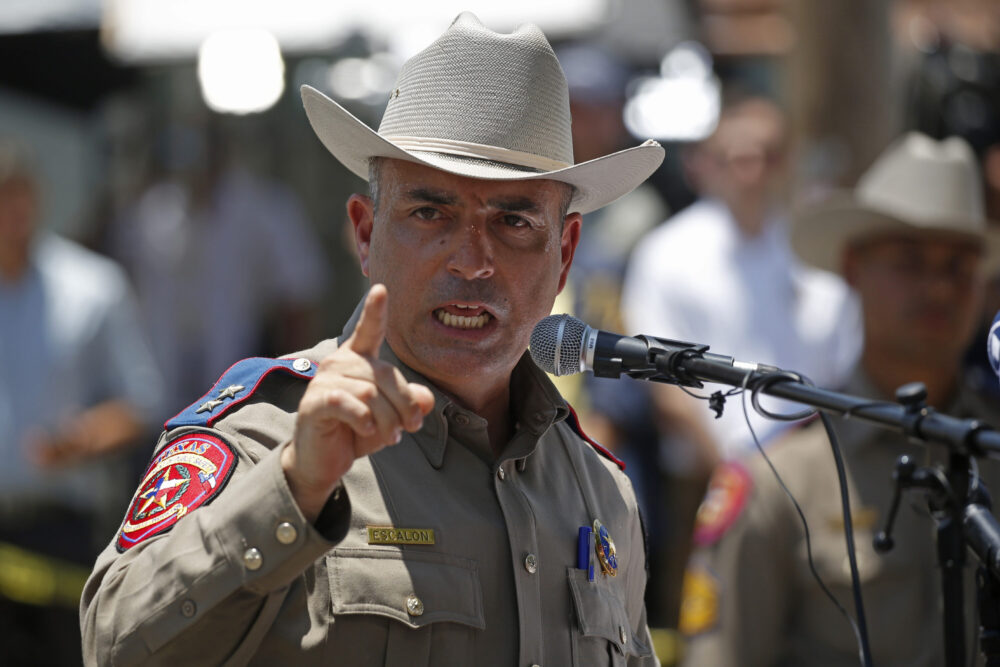 Victor Escalon, Regional Director of the Texas Department of Public Safety South, speaks to the press during a news conference outside of Robb Elementary School in Uvalde, Texas, Thursday, May 26, 2022. Escalon says the 18-year-old gunman who slaughtered 21 people at an elementary school entered the building "unobstructed" through a door that was apparently unlocked. 