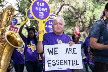Houston janitors protest for a $15 minimum wage near City Hall on May 18, 2022.