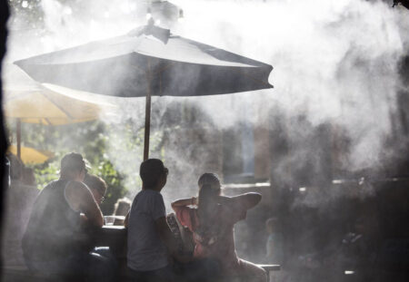 Water misters help patrons cool off in the summertime heat at Guero's Taco Bar in Austin.