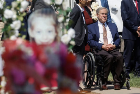 Gov. Greg Abbott visits a memorial at Robb Elementary School in Uvalde on May 29, five days after a gunman killed 19 children and two teachers at the school.