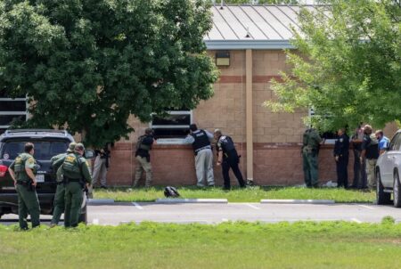 Authorities prepare to evacuate students and teachers after a gunman entered Robb Elementary School in Uvalde on May 24, 2022.