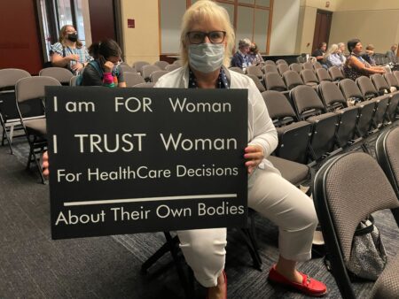 Patricia Ledbetter of DeSoto holds a sign supporting women's rights at the Texas Democratic Party's biennial convention in Dallas.