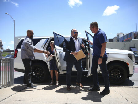 Alex Jones arrives at the Travis County Courthouse in Austin, Tuesday Aug. 2, 2022. The father of a 6-year-old killed in the Sandy Hook Elementary School shooting has testified that conspiracy theorist Alex Jones made his life a “living hell” by pushing claims the murders were a hoax. Neil Heslin testified Tuesday that he fears for his life because of Jones' claims. Heslin and Scarlett Lewis are the parents of 6-year-old Jesse Lewis. (Briana Sanchez/Austin American-Statesman via AP)