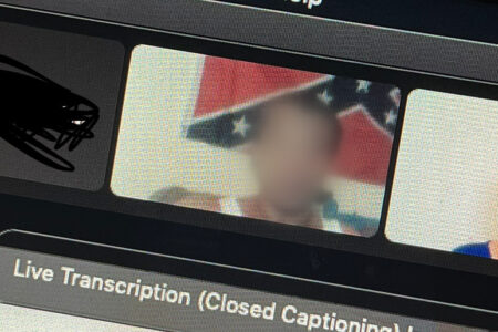 The new employee allegedly sat in front of a confederate flag for a majority of the six-hour orientation on August 9, 2022. Houston Public Media has blurred the employee's face.