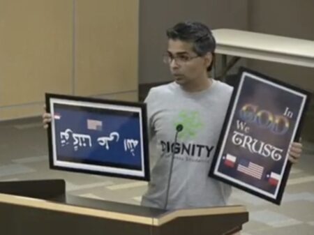 "Why is more God not good?" asked Srivan Krishna, as he sought to donate colorful "In God We Trust" signs at a school board meeting earlier this week.