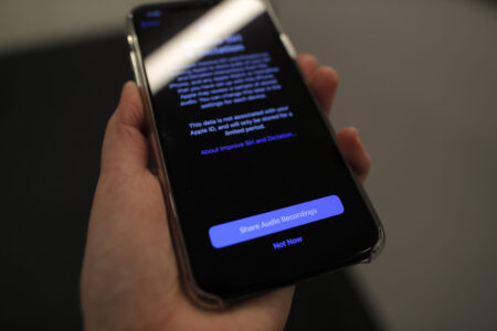 FILE - A screen displays a notice  on an iPhone on Tuesday, Oct. 29, 2019, in New York. U.S. communications regulators are requiring that phone companies allow people to text as well as call a new “988” number for the suicide-prevention hotline. The Federal Communications Commission last summer voted to require phone companies support the 988 number for people to call to reach an existing suicide-prevention hotline.