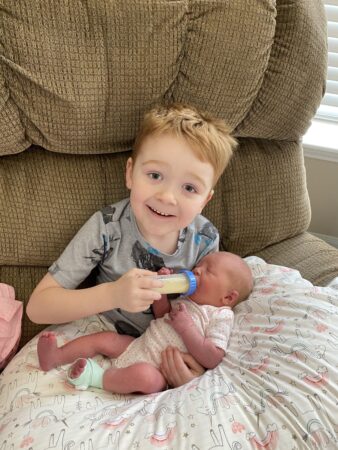 Jackson meeting his newborn baby sister for the first time.