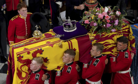 The bearer party with the coffin of Queen Elizabeth II as it is taken from Westminster Abbey, London, Monday, Sept. 19, 2022 at the end of service during the State Funeral of the late monarch.
