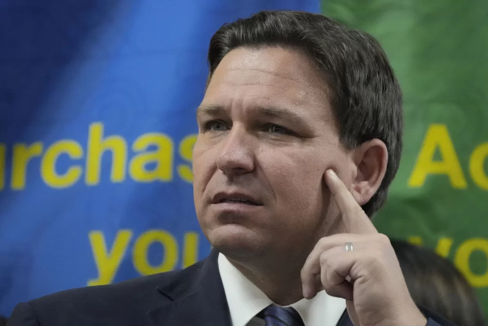 FILE - A group of asylum seekers who were flown from Texas to Massachusetts on orders from Florida Gov. Ron DeSantis have sued the Republican leader and other state officials.