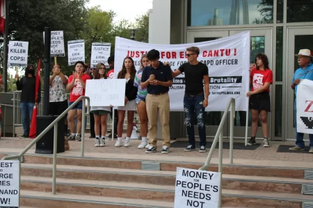 Friends of Erik Cantu gathered on the steps of SAPD headquarters asking for justice for their friend. George Ramos, one of Cantu's close friends, stands in the center.
