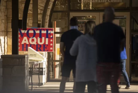 Voters wait in line at a polling site at Austin Oaks Church in Austin, Texas, on Oct. 14, 2020.