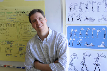 FILE - In this March 1, 2011 file photo, Jeff Kinney, author of the "Diary of a Wimpy Kid" children's book series, poses for a portrait at his office in Boston. The first 11 novels have sold more than 180 million copies and the series has been the basis for four movies. (AP Photo/Gretchen Ertl, File)