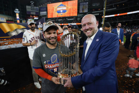 Houston Astros second baseman Jose Altuve and general manager James click celebrate with the trophy after their 4-1 World Series win against the Philadelphia Phillies in Game 6 on Saturday, Nov. 5, 2022, in Houston.
