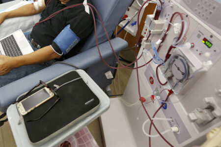 FILE - A patient undergoes dialysis at a clinic. (AP Photo/Rich Pedroncelli, File)
