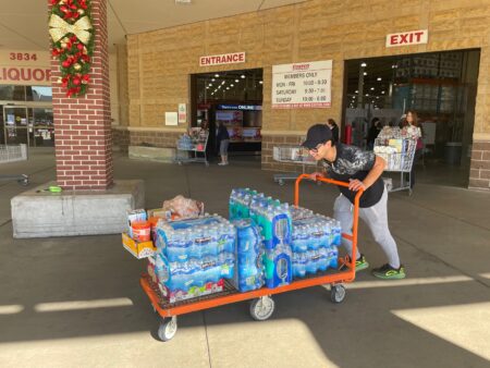 FILE: Customers at Costco off Richmond buying packs of water by the cart on Monday, Nov. 28, 2022, after the city of Houston sent out a boil water notice on Sunday night.